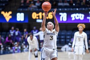 WVU overcomes injuries, foul trouble to beat TCU 81-78